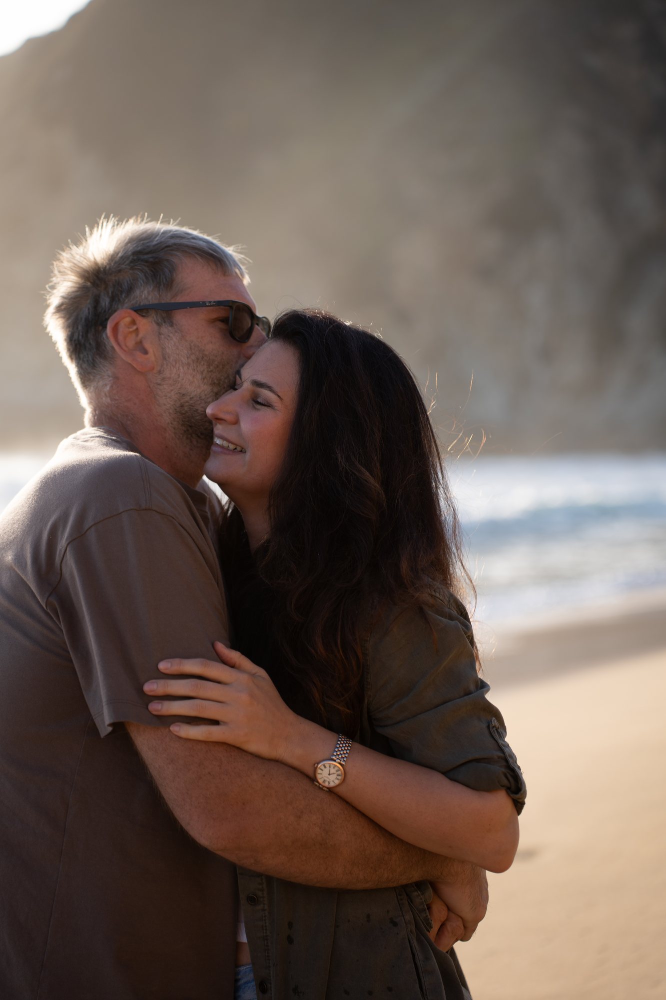 A tender kiss by the water