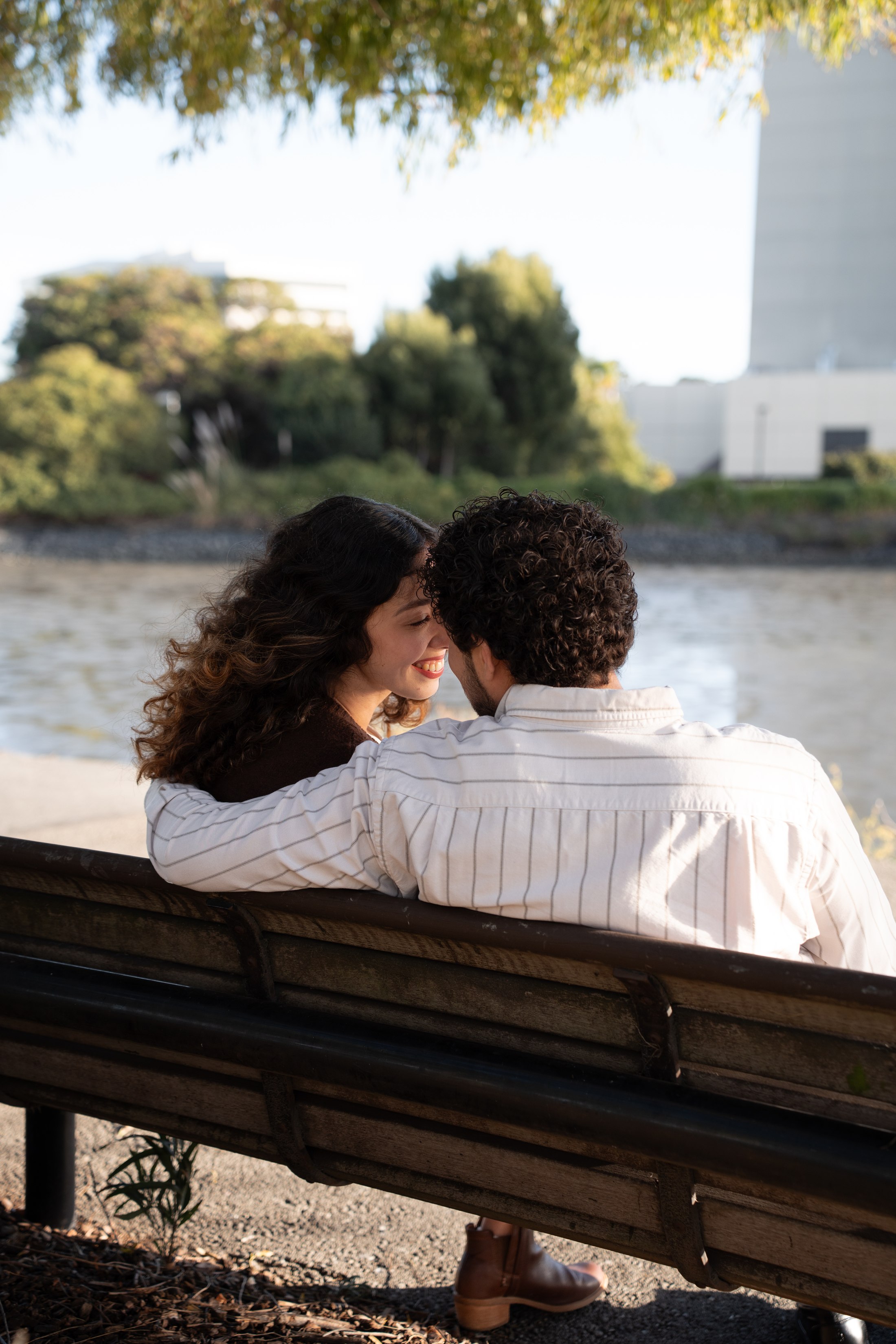 A woman turning toward her partner on the bench