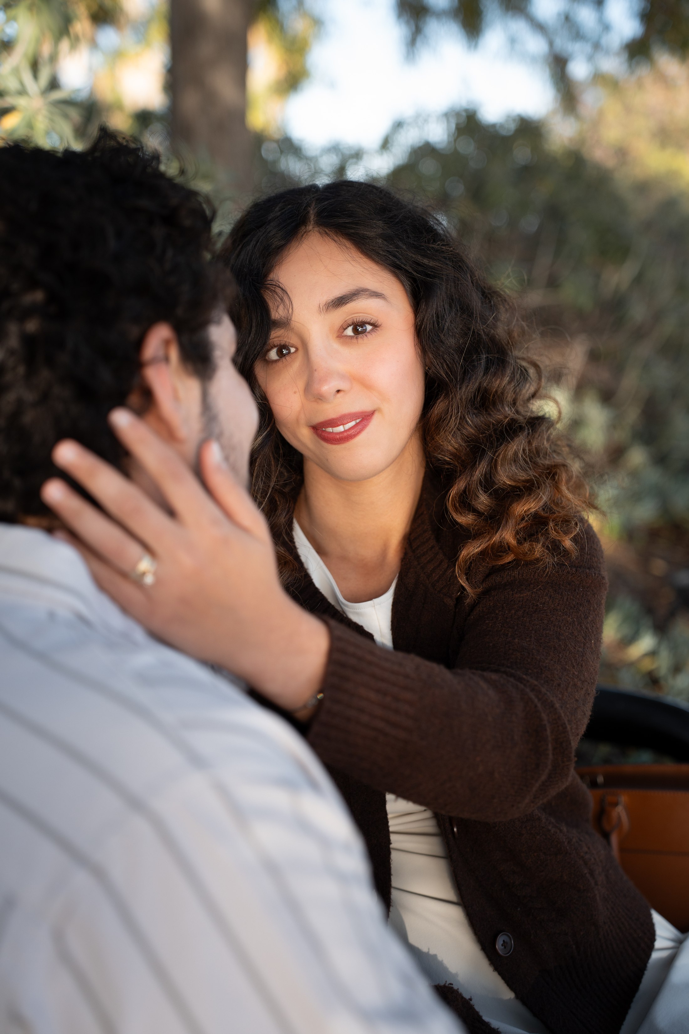A close portrait of the woman looking at her partner
