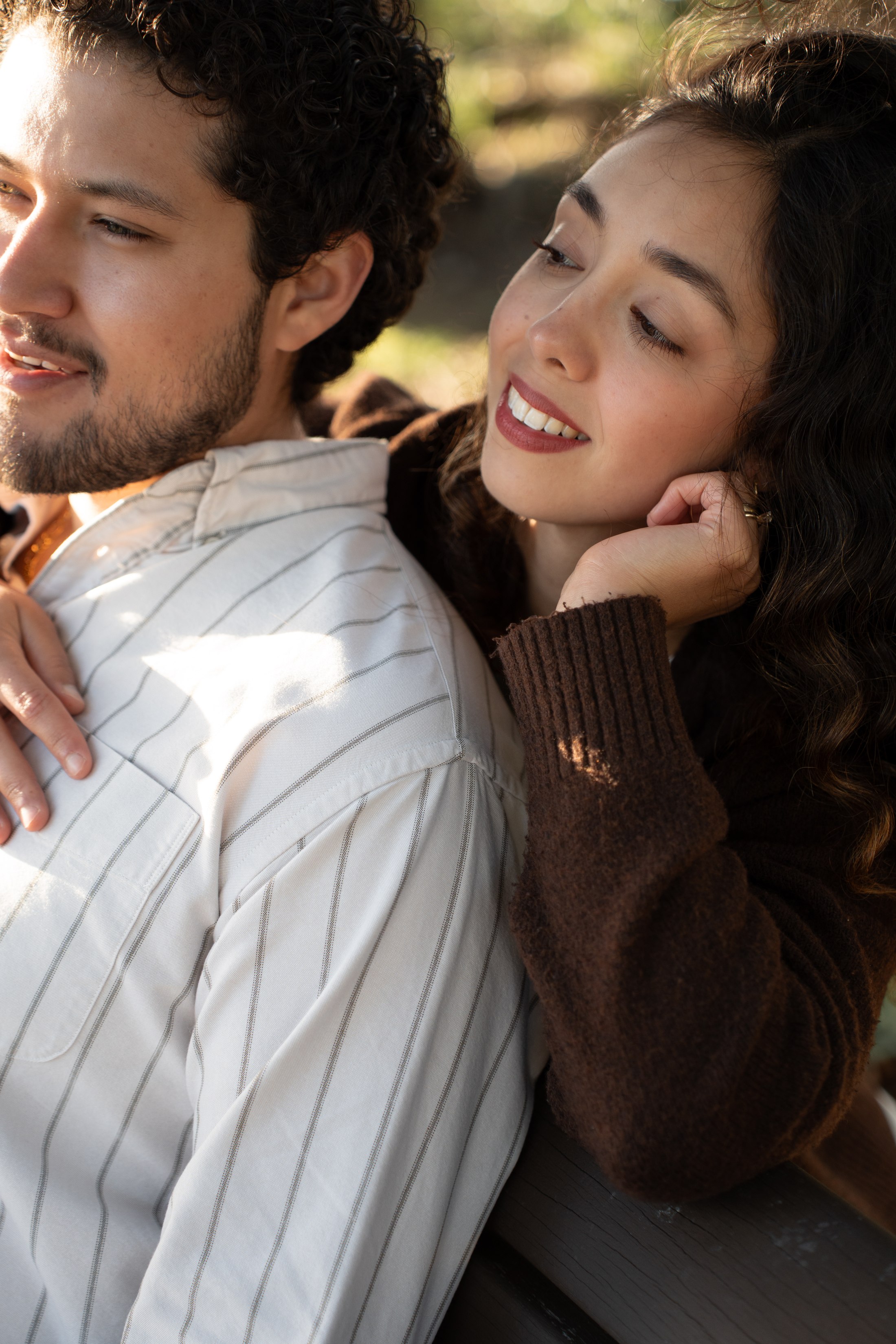 A close, tender moment with a hand resting on a shoulder