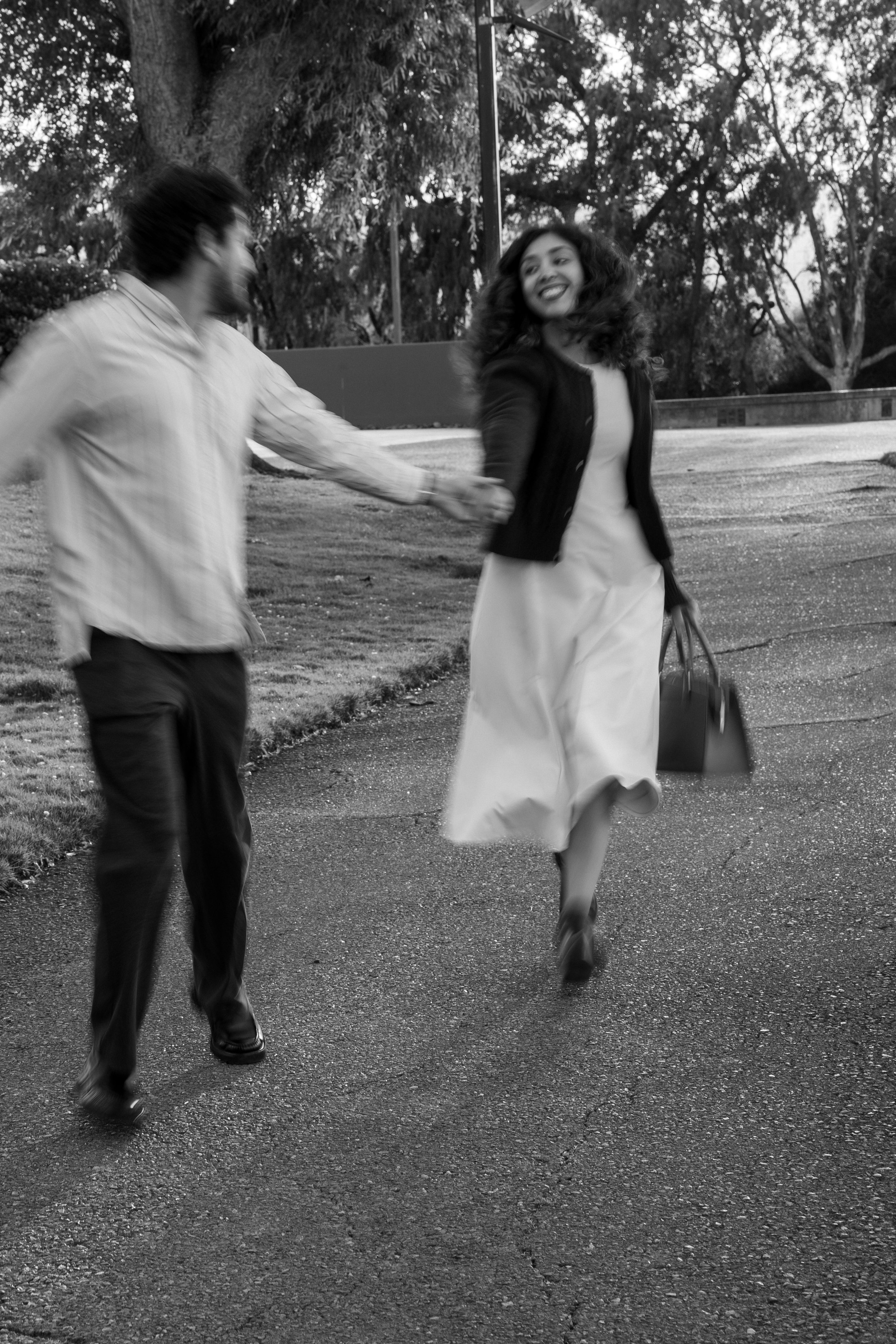 A soft black-and-white moment as the couple walks together