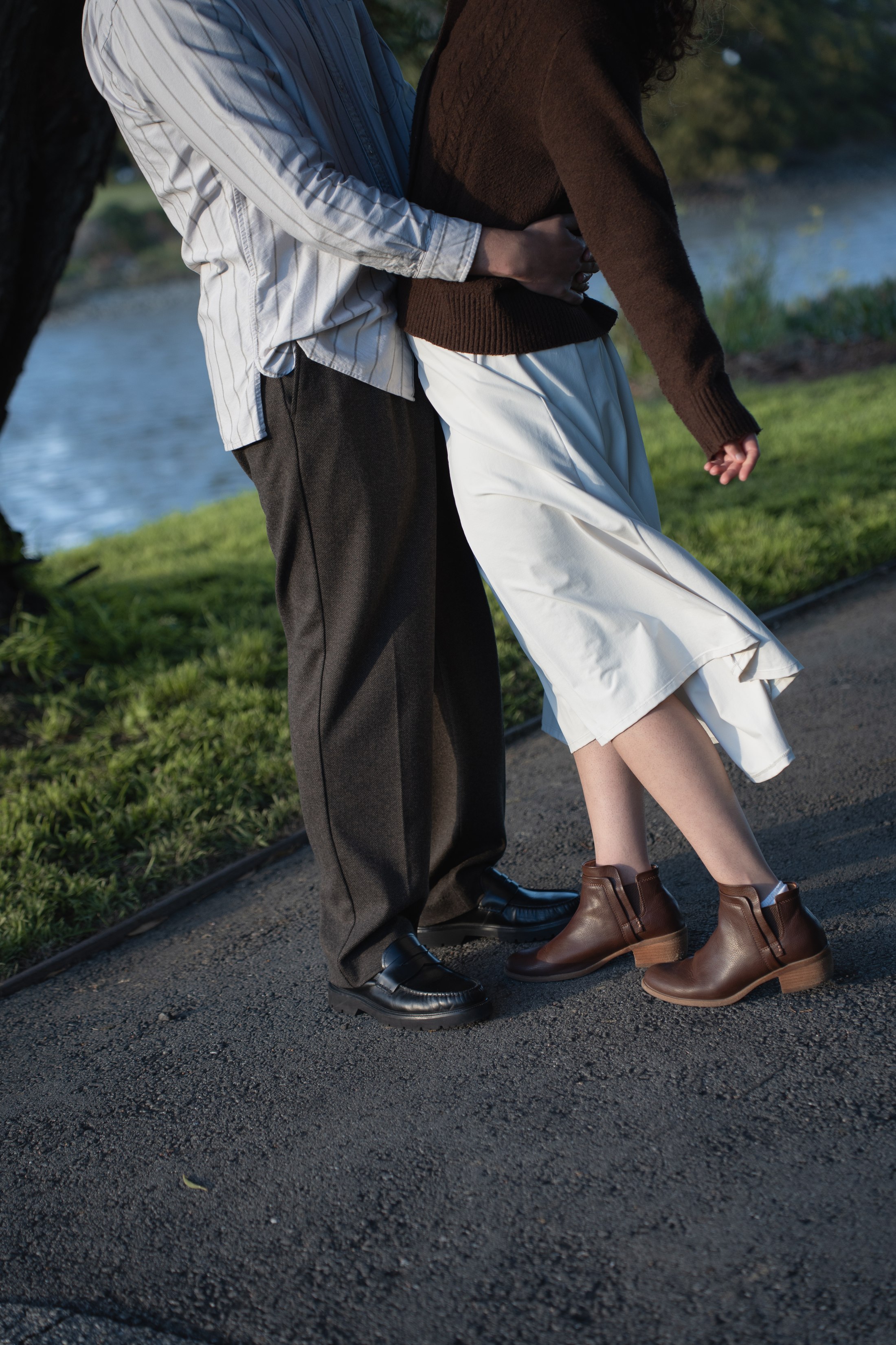A moving detail of the woman's dress as they walk