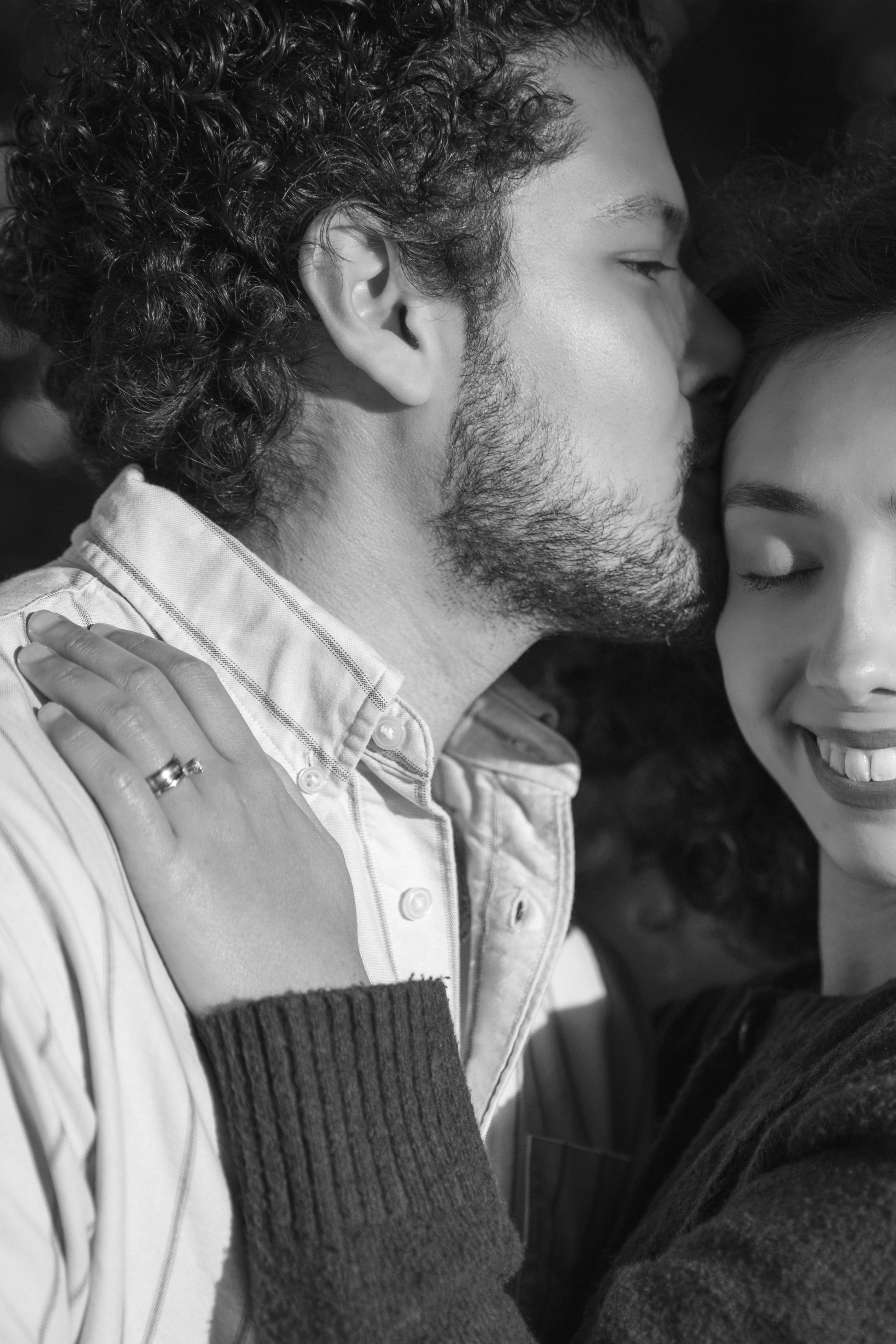 An intimate black-and-white portrait of the couple