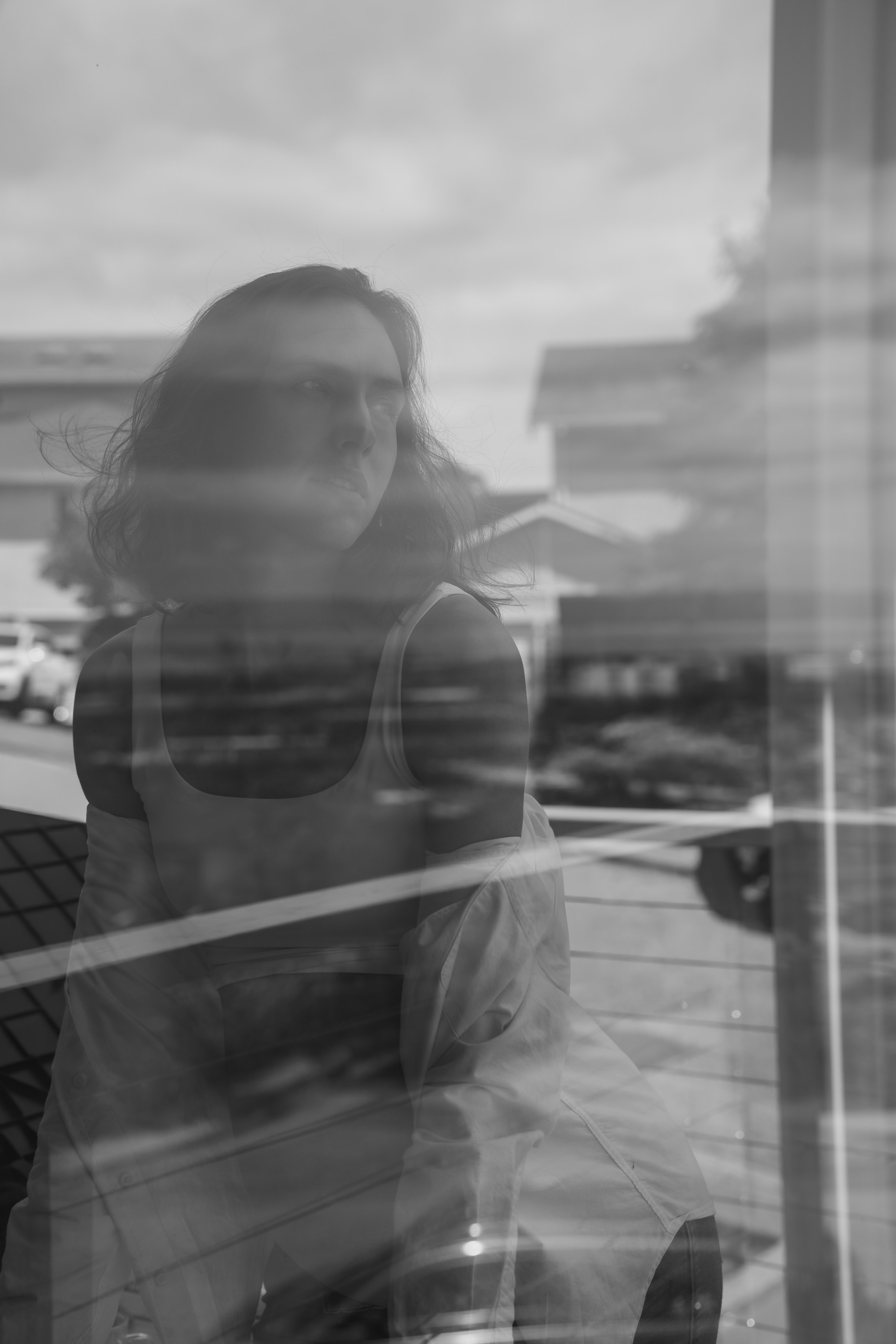 A soft reflection of the mother-to-be in a window