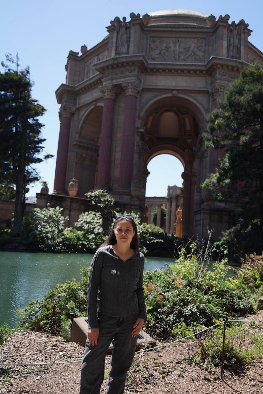 A full-length portrait in front of the Palace of Fine Arts
